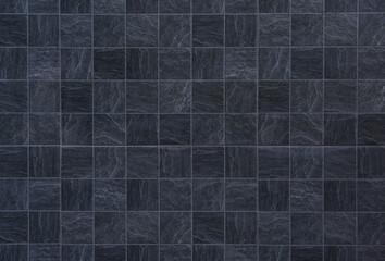 Black marble tile texture background.