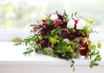 Unusual wedding composition with succulent flowers, fig and hop in retro style