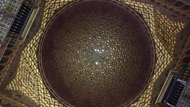View of ceiling of Royal Alcazar of Seville is historic palace in Spain and formerly the site of the Islamic-era citadel of the city begun in the 10th century and then developed into larger complex 4k