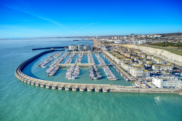 Aerial view of Brighton Marina in East Sussex, Southern England, with chalk cliffs and Brighton City in the background.