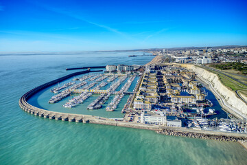 Brighton Marina in East Sussex, Southern England, with chalk cliffs and Brighton City in the background Aerial photo.