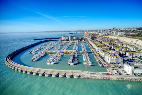 Aerial photo of Brighton Marina in East Sussex, Southern England, with chalk cliffs and Brighton City in the background.