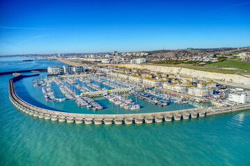 Brighton Marina in East Sussex, Southern England, with chalk cliffs and Brighton City in the background, Aerial photo from the sea. - obrazy, fototapety, plakaty