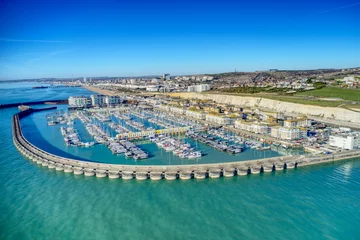 Fotobehang Brighton Marina in East Sussex, Southern England, with chalk cliffs and Brighton City in the background, Aerial photo from the sea. © Geoff