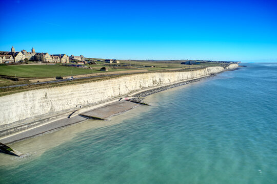 The chalk cliffs of East Sussex at Roedean near Brighton looking east towards Rottingdean, with the Roedean Girls School in view.