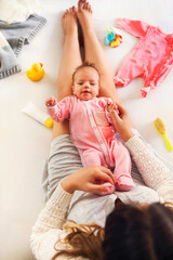 Fototapeta premium Young mother holding her newborn child