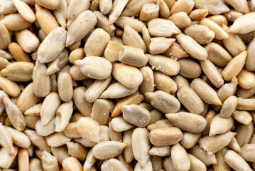 Background of peeled sunflower seeds close-up. Seeds. View from above
