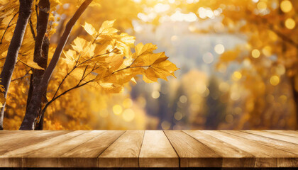 The empty wooden table top with blur background of autumn 