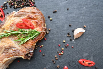 overhead view of grilled pork steak on the bone