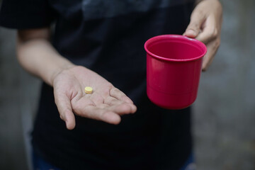 Close up of woman hand holding pills. Health care and medical concept.