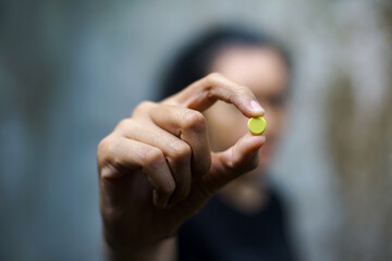 Close up of woman hand holding pills. Health care and medical concept.