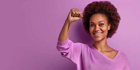 Smiling woman with holds fist up on the purple background. Banner with copy space