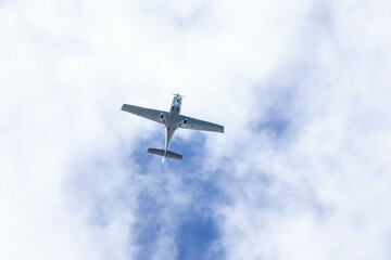 Small plane. A single engine plane crosses the blue sky. Transportation.
