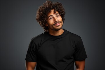 Obraz premium A portrait of a curious and handsome young man with a puzzled yet interested expression, showcasing happiness.
