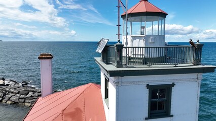 Lighthouse in Oswego New York close up on Lake Ontario at the mouth of Oswego River and harbor in small town on the coast of the Great Lake Historic Architecture Harbor beacon for boaters