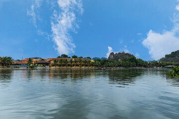 Fototapeta na wymiar Ninh Binh landscpae in Vietnam. Tam Coc lake area with Karst landscape and river.