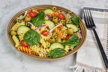 tri color rotini pasta salad with spinach