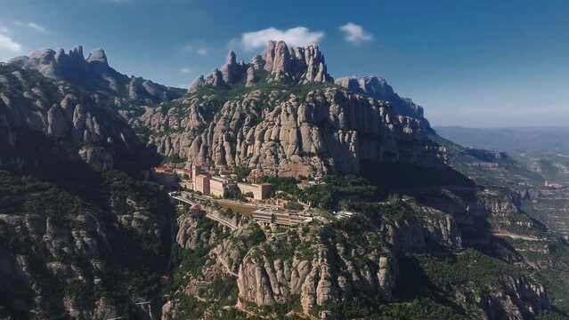 Aerial view of the Benedict church Abbey of Monserrat from Barcelona, Spain. Montserrat Monastery, Santa Maria de Montserrat is a Benedictine abbey located on the mountain of Montserrat