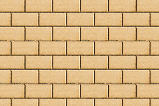 Yellow brick pavement texture. Even blocks pattern. Brick flooring. Outdoor sunny texture. Walkway background. Brick pattern. Closeup construction.