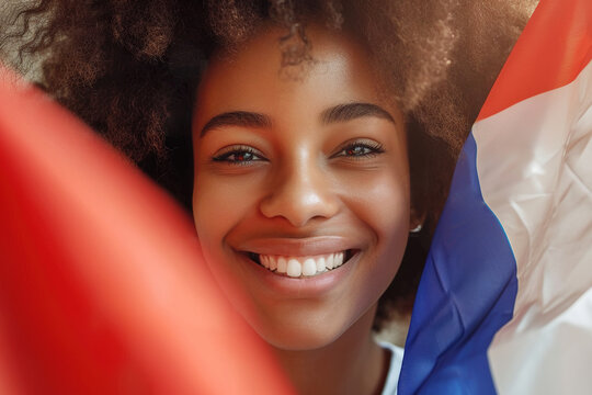 Fototapeta Portrait of attractive cheerful African american woman holding france flag 