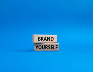 Brand yourself symbol. Concept word Brand yourself on wooden blocks. Beautiful blue background. Business and Brand yourself concept. Copy space