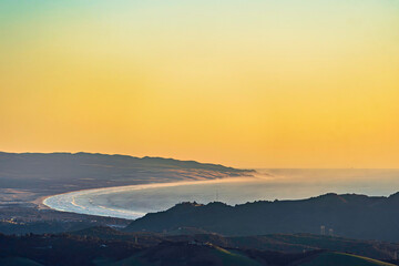 Yellow sunset, sunrise over ocean, sea, from view hills