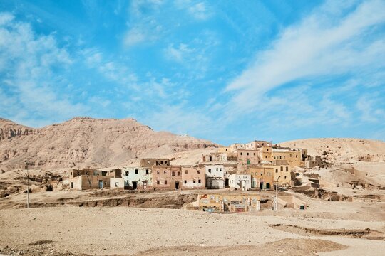Luxor, Egypt - December 26 2023: Abandoned village of Old Qurna and traditional mud brick homes built over the ancient tombs on the West Bank
