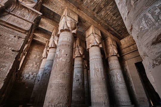 Qena, Egypt - December 27 2023: Columns of the Hypostyle Hall in Temple of Hathor in Dendera Temple complex, one of the best-preserved temple