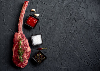 raw Steak 
Tomahawk on stone background with copy space for your text