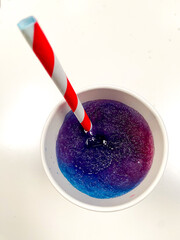 Top down view of a slushy, a chilled, iced, sweet fruit flavoured drink 