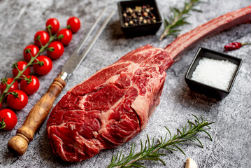 raw Steak 
Tomahawk on stone background 