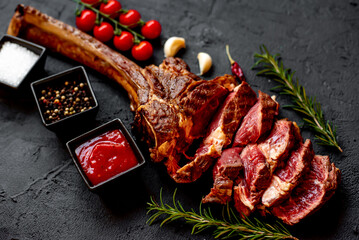 Grilled Tomahawk steak on stone background 