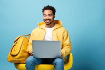 Smiling African American man working on laptop