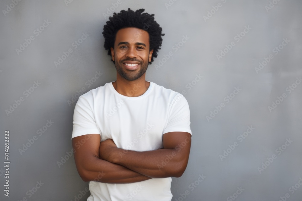 Canvas Prints Smiling Afro American man poses against white wall