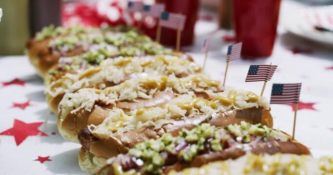American flag, food and hot dog for independence day, traditional meal and lunch for national holiday. Dish, fourth of July and patriotic buffet on table, submarine sandwich and nutrition or protein