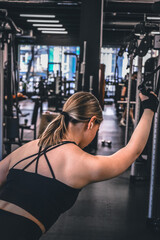 Fototapeta na wymiar Gym.Fitness woman working out in the gym, doing exercises for health and beautiful figure.fitness in gym,fitness girl,fitness,fitness,mental health,active lifestyle,self-care,health,wellness,fitness