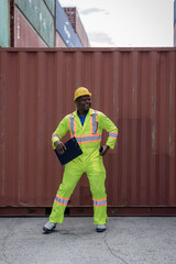 Funny factory workers dance in Container cargo site. Happy people at work .  Foreman or worker Dancing on shipping containers. Logistics and shipping