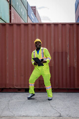 Funny factory workers dance in Container cargo site. Happy people at work .  Foreman or worker Dancing on shipping containers. Logistics and shipping