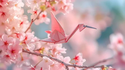Zelfklevend Fotobehang a pink origami bird sitting on top of a tree © KWY