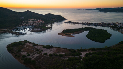 Barra de Navidad Aerial of Jalisco Mexico resort beach town with pacific coastline ocean view at sunset and lake lagoon