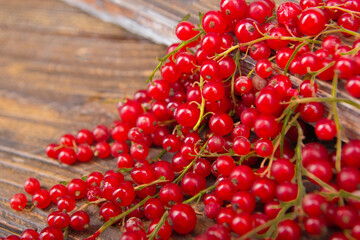 currants on wooden table background, spilled from a spice jar. .Antioxidants, detox diet, organic fruits. Berries