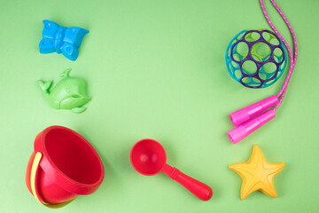 Multi-colored children's toys on a colorful background.