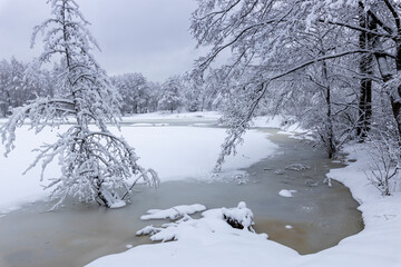 Winter day on the pond after heavy snowfall.