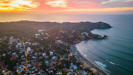 Aerial drone Sayulita Mexico Mexican Pacific Ocean coastline at sunset 