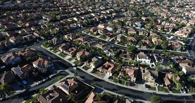 4k Aerial View of a Housing Development Neighborhood In the Morning Light.