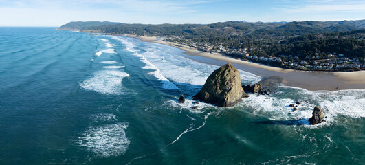 Sunlight shines down on the coast of Oregon near Cannon Beach. This scenic region, where forest...