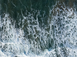 Seen from above, gentle waves create patterns in the water along the coast of Oregon. This scenic...