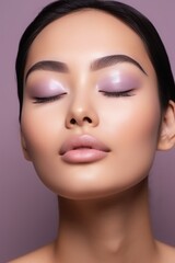 Asian girl with her eyes closed on a studio background. flawless skin, beautiful natural makeup. beauty and health, spa and cosmetology.