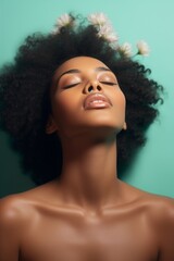 A beautiful African American black girl with her eyes closed. Plump lips, beautiful skin and natural makeup. the concept of beauty and health care, spa and cosmetology.