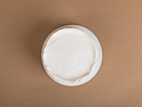 Simple bento cake mockup, top view on cream surface